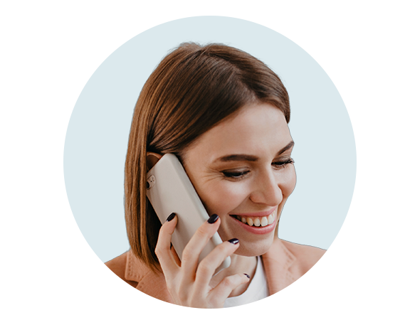 Smiling woman talking on the phone, representing customer service support